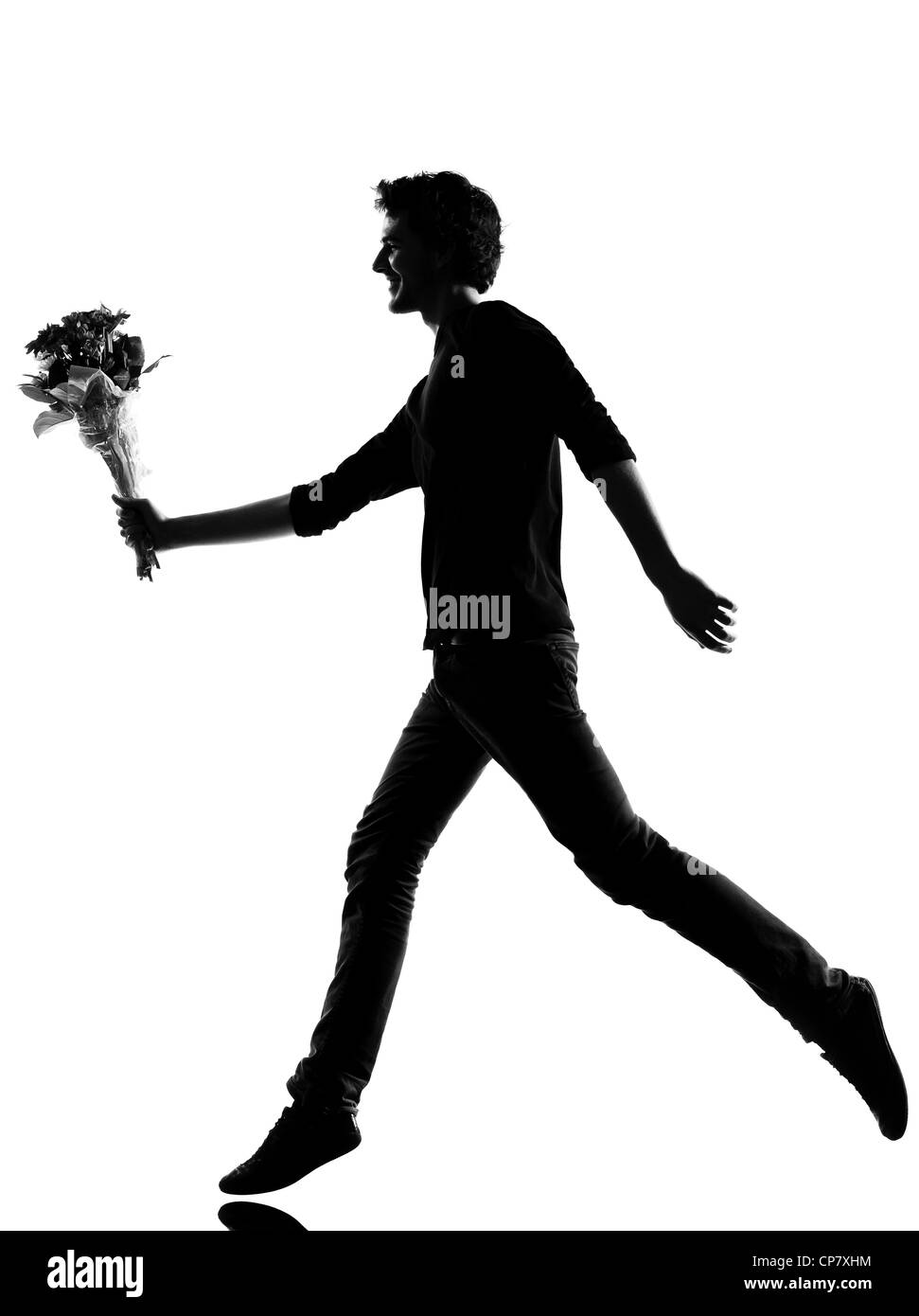 junger Mann mit Blumen Blumenstrauß Silhouette im Studio isoliert auf weißem Hintergrund Stockfoto