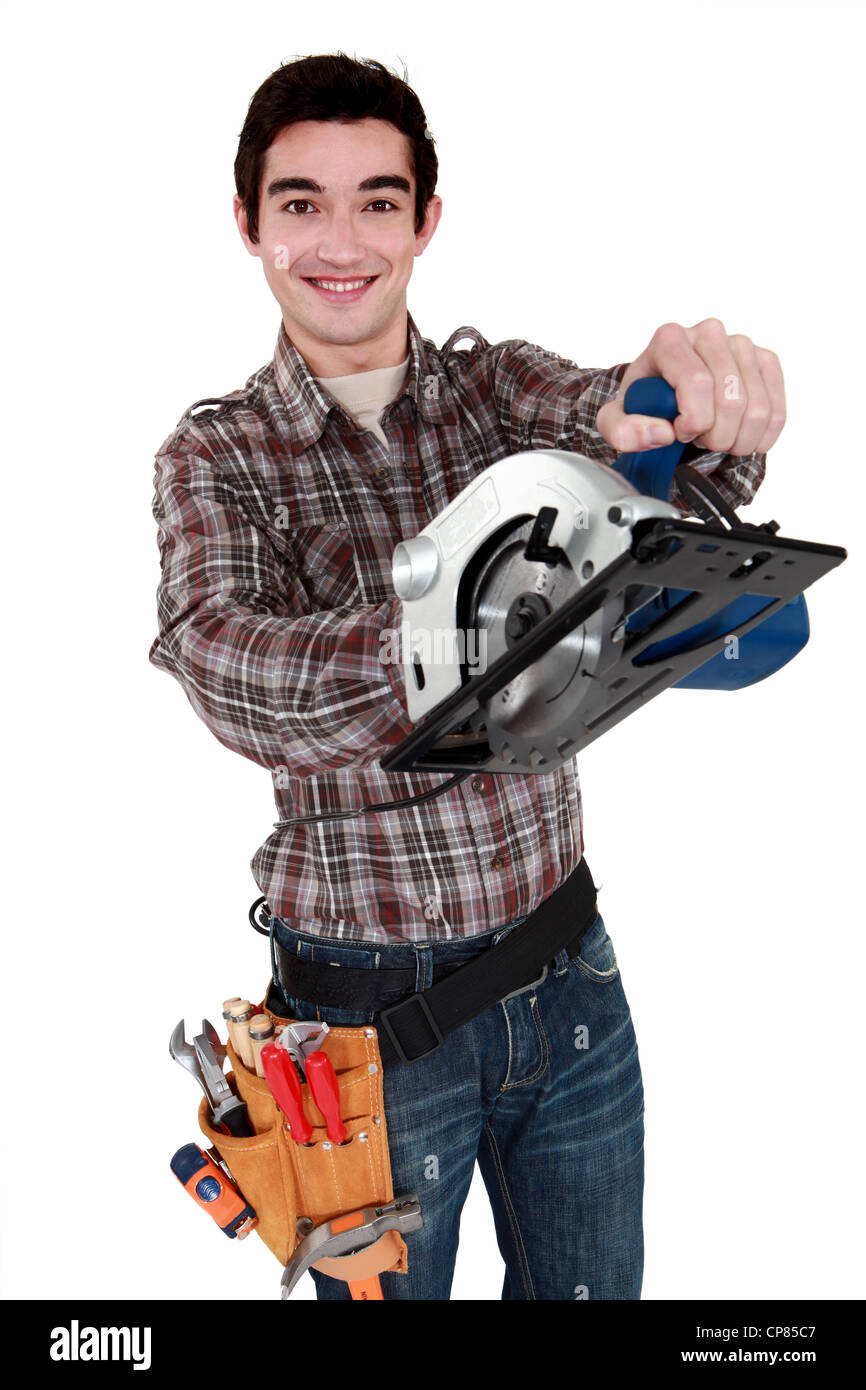 Handwerker mit einer elektrischen Säge Stockfoto