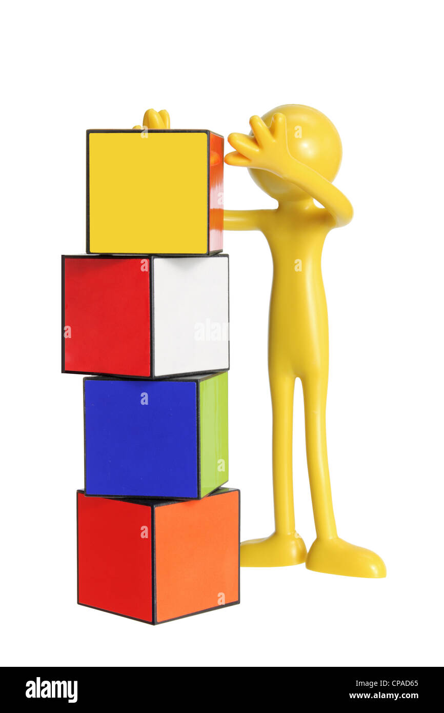 Miniatur-Kautschuk-Figur mit Würfel Stockfoto