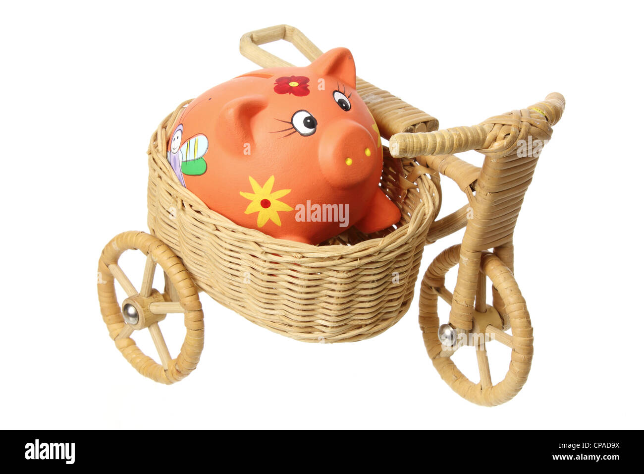Sparschwein auf Miniatur-Dreirad Stockfoto