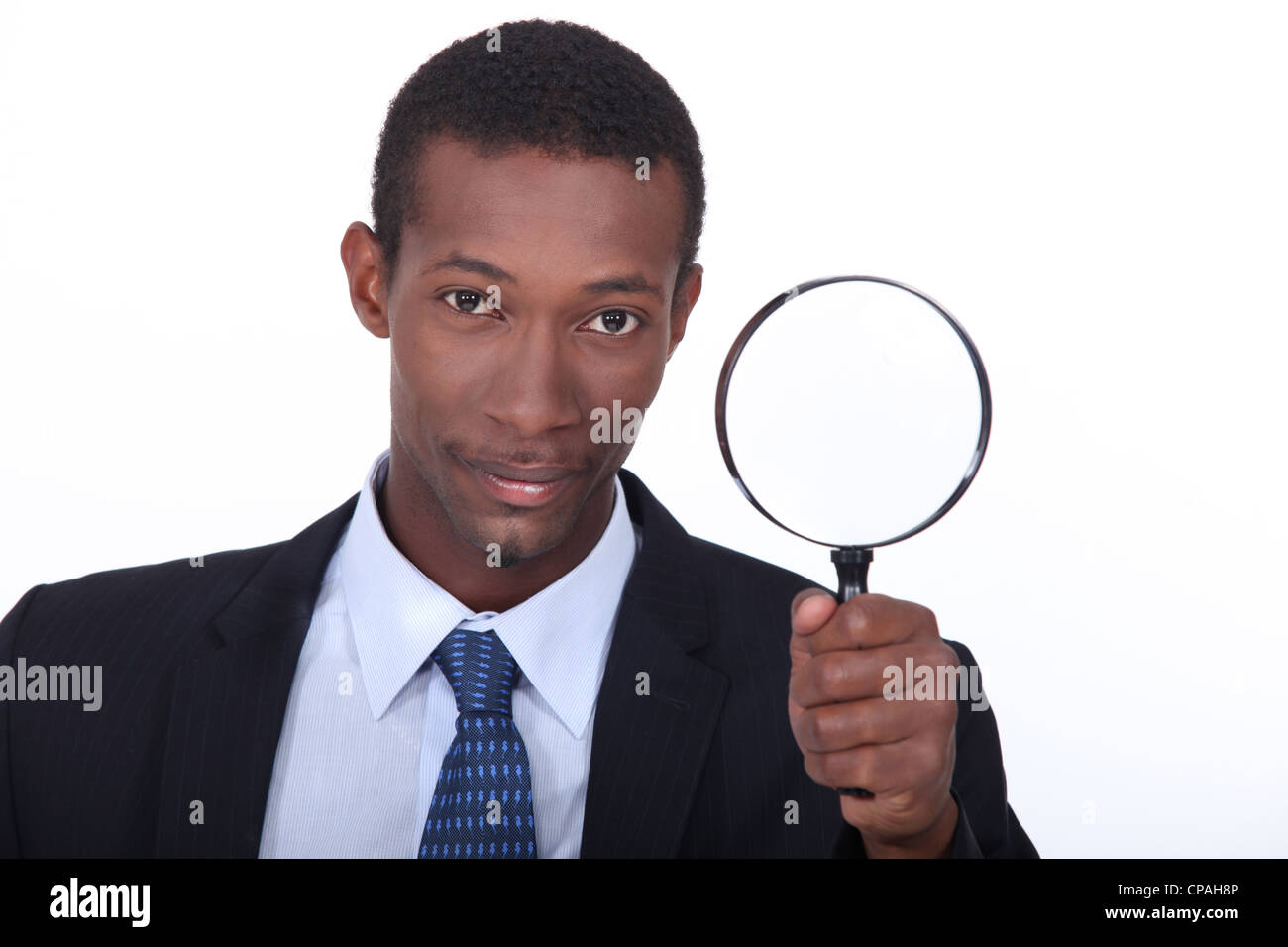 Porträt eines Mannes mit Lupe Stockfoto
