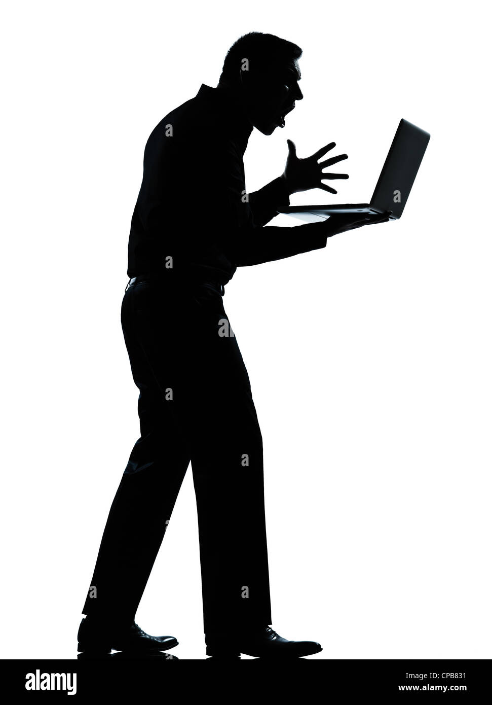 eine kaukasische Geschäftsmann computing Computer Laptop wütend unzufrieden Silhouette stehend voller Länge im Studio isoliert auf weißem Hintergrund Stockfoto