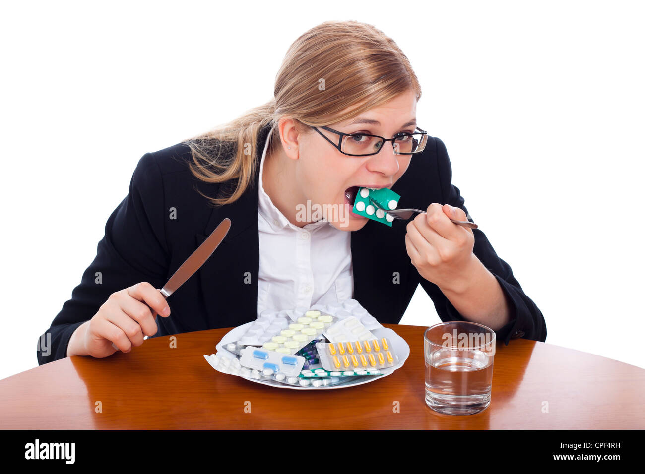 Frau, Essen, Drogen, Tabletten und Pillen, isoliert auf weißem Hintergrund. Stockfoto