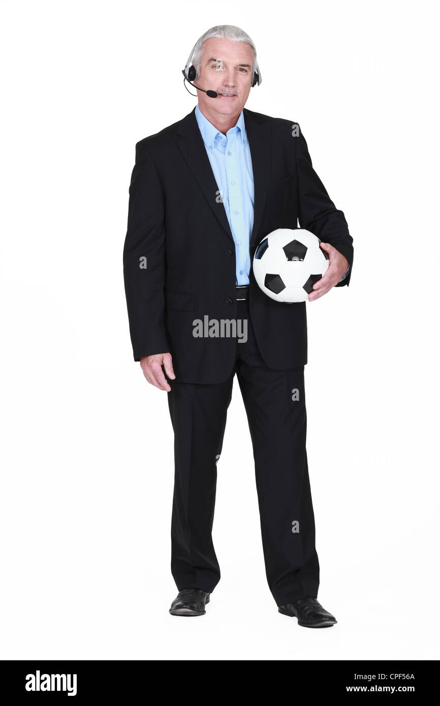Fußball-Kommentator holding Stockfoto