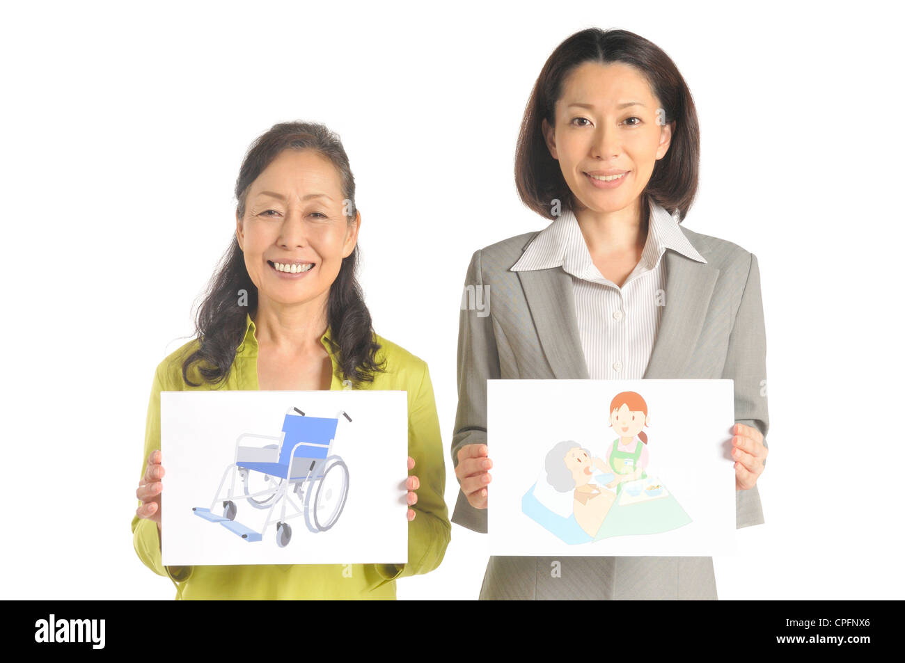 Ältere Frau und Pflege Manager zeigt Board der Krankenpflege Stockfoto