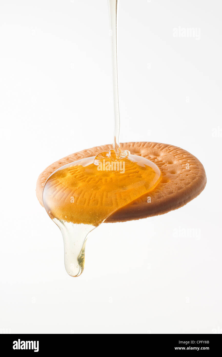 Zwieback und Honig Stockfoto