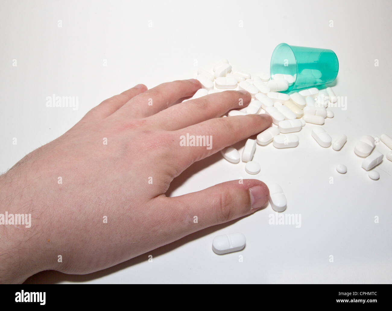 weißen Pillen und hand Stockfoto