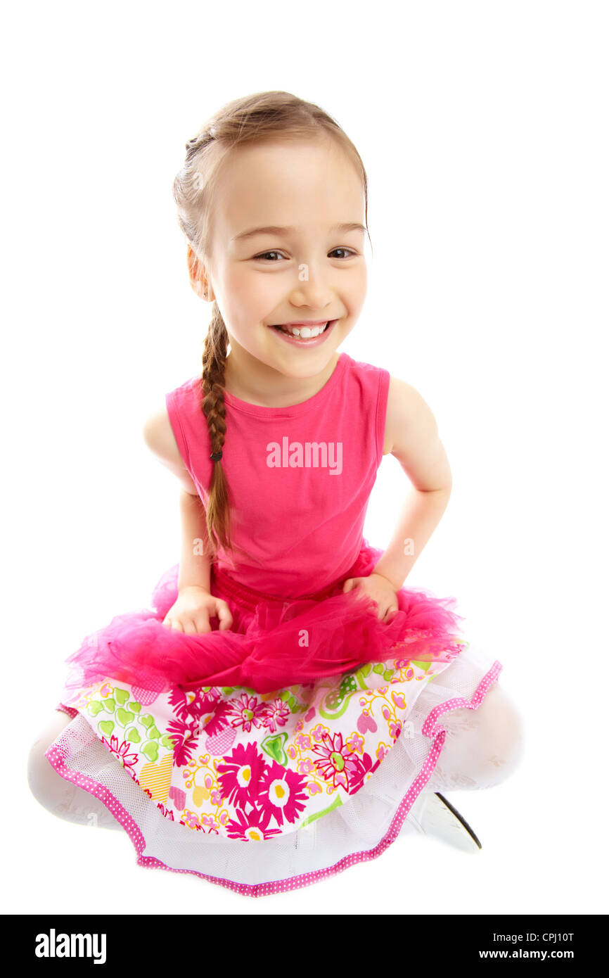 Bild von einem charmanten Mädchen lächelnd in die Kamera, isoliert auf weißem Hintergrund Stockfoto