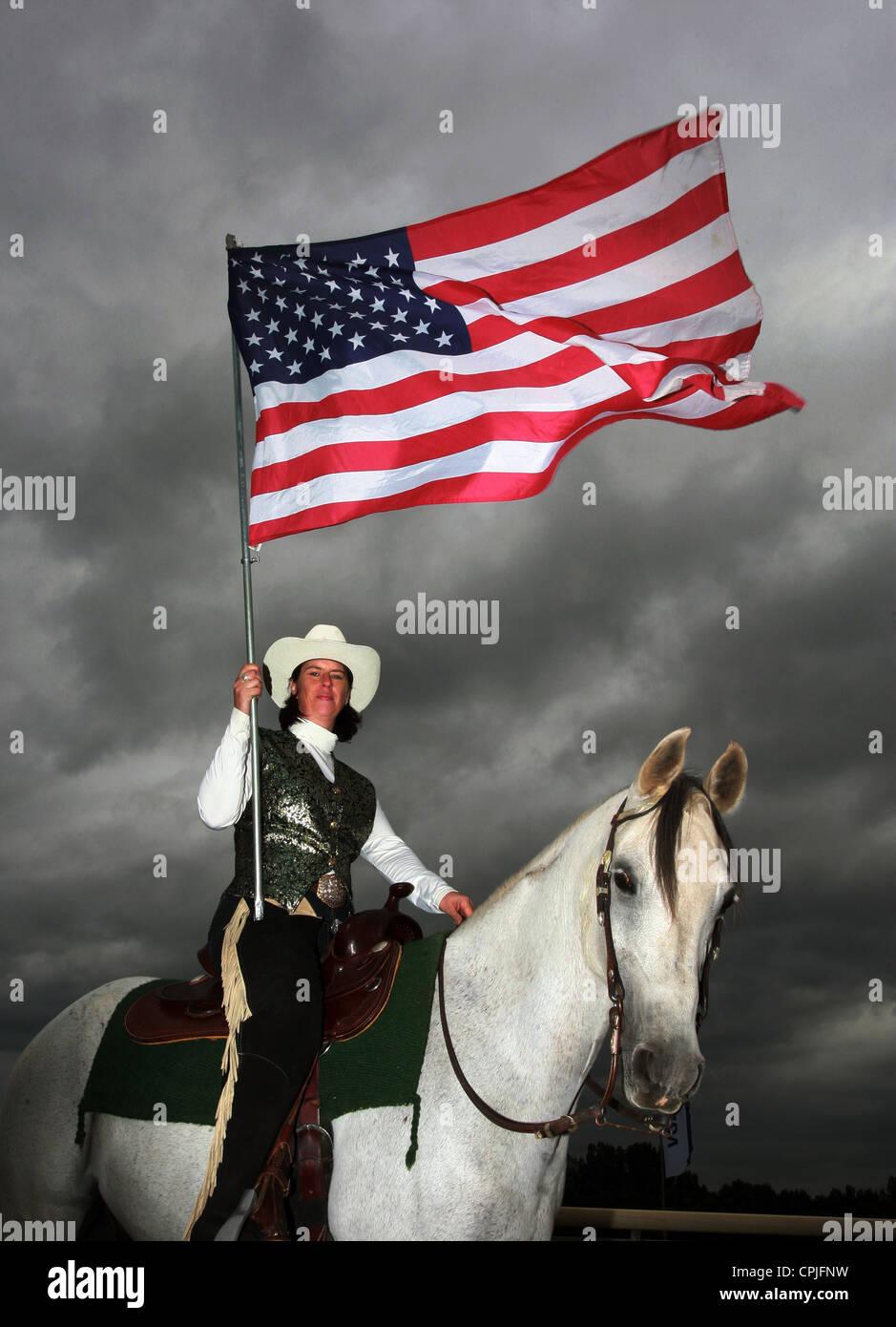Western Reiter mit der Flagge der USA, Hannover, Deutschland Stockfoto