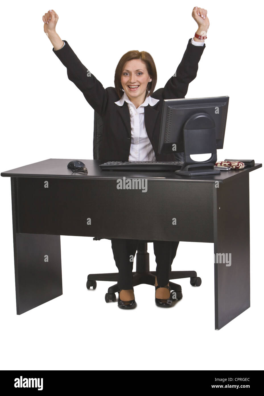 Erfolgreiche junge Geschäftsfrau an ihrem Schreibtisch vor einem weißen Hintergrund isoliert. Stockfoto