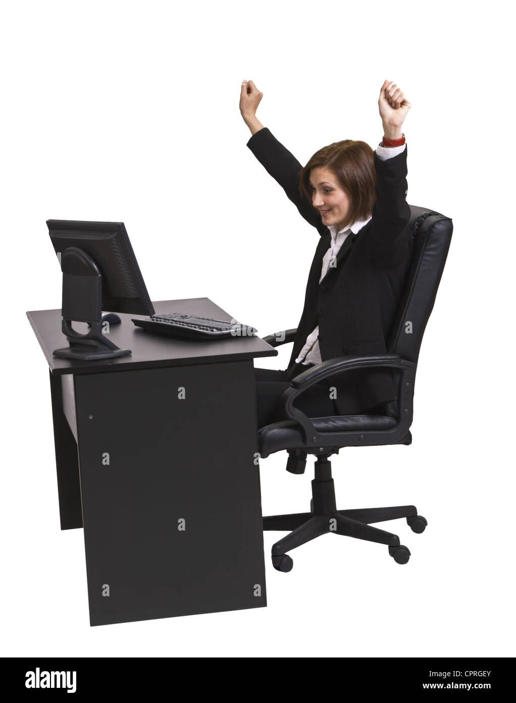 Erfolgreiche junge Geschäftsfrau an ihrem Schreibtisch vor einem weißen Hintergrund isoliert. Stockfoto