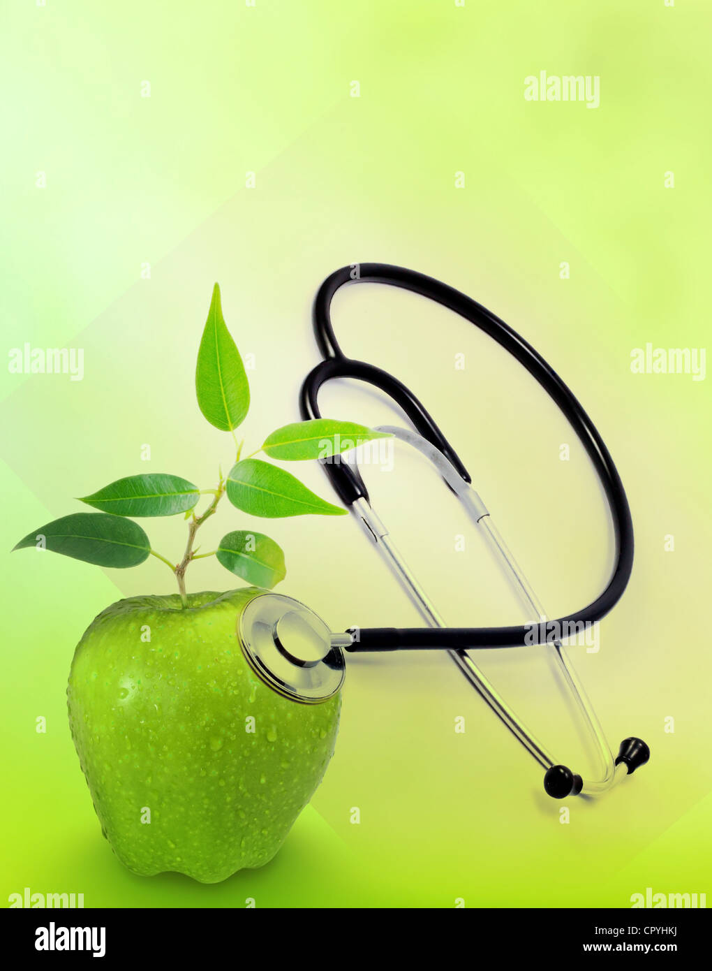 Gesundheit und Medizin-Hintergrund-Konzept mit Stethoskop und Green Apple wie ein Zeichen von Gesundheit Stockfoto