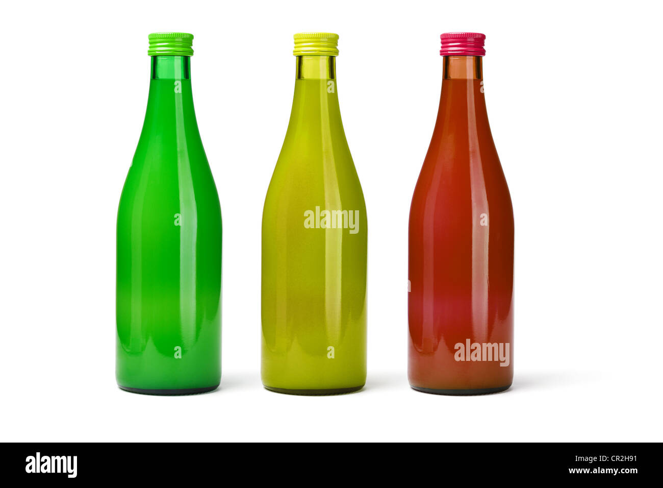 Drei Glas-Flaschen von Fruchtsäften auf weißem Hintergrund Stockfoto