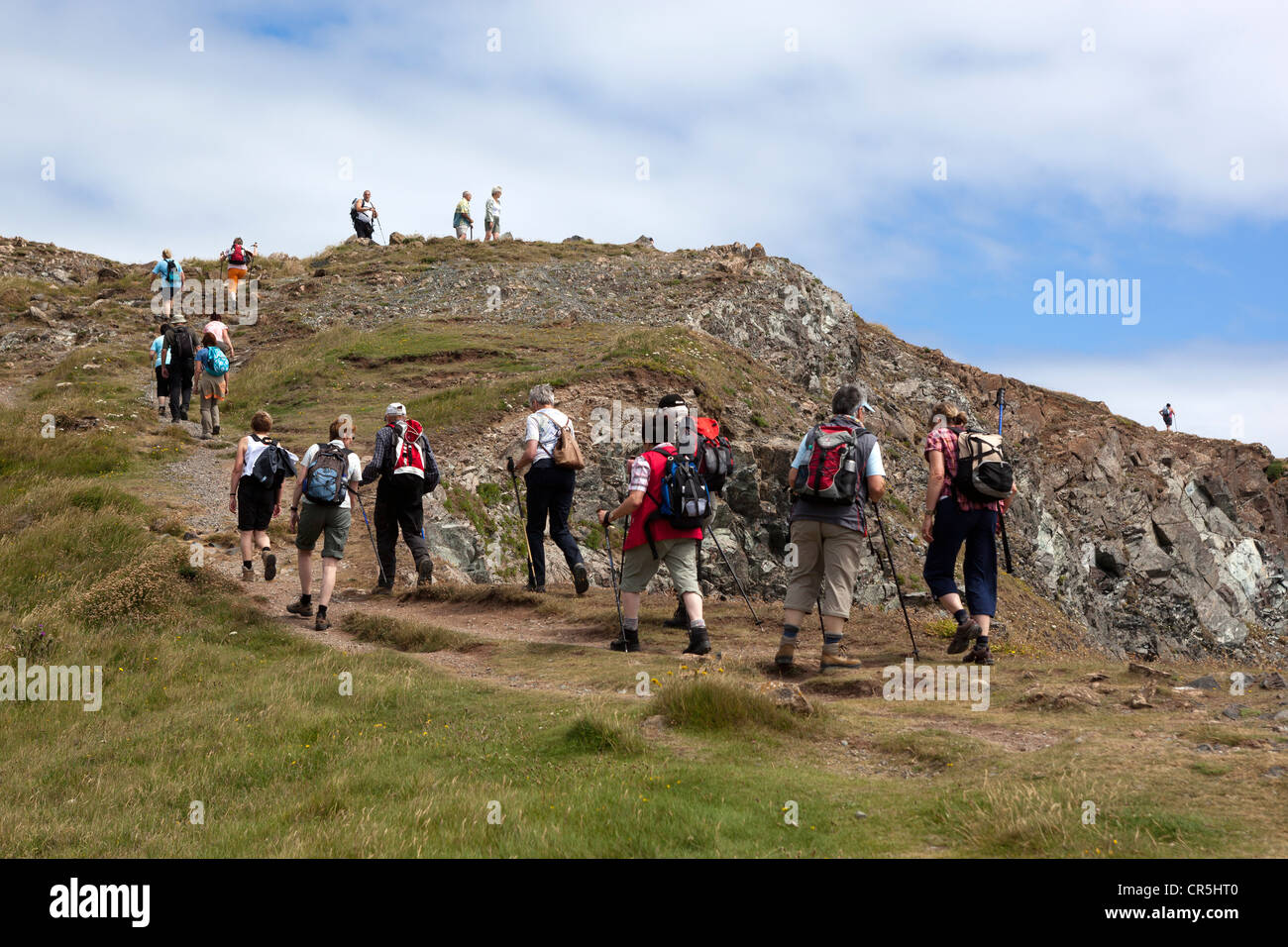 Wanderer auf die rührende oben Kynance Cove Stockfoto