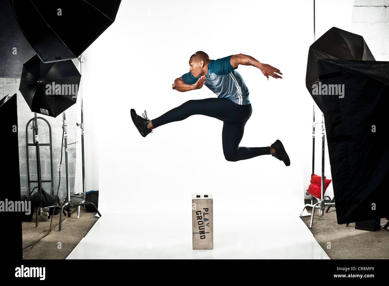 Sportler beim Fotoshooting, springen Stockfoto