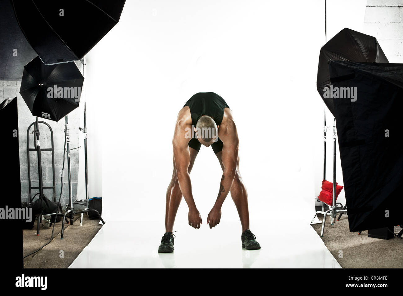 Athleten am Foto schießen, Dehnung Stockfoto