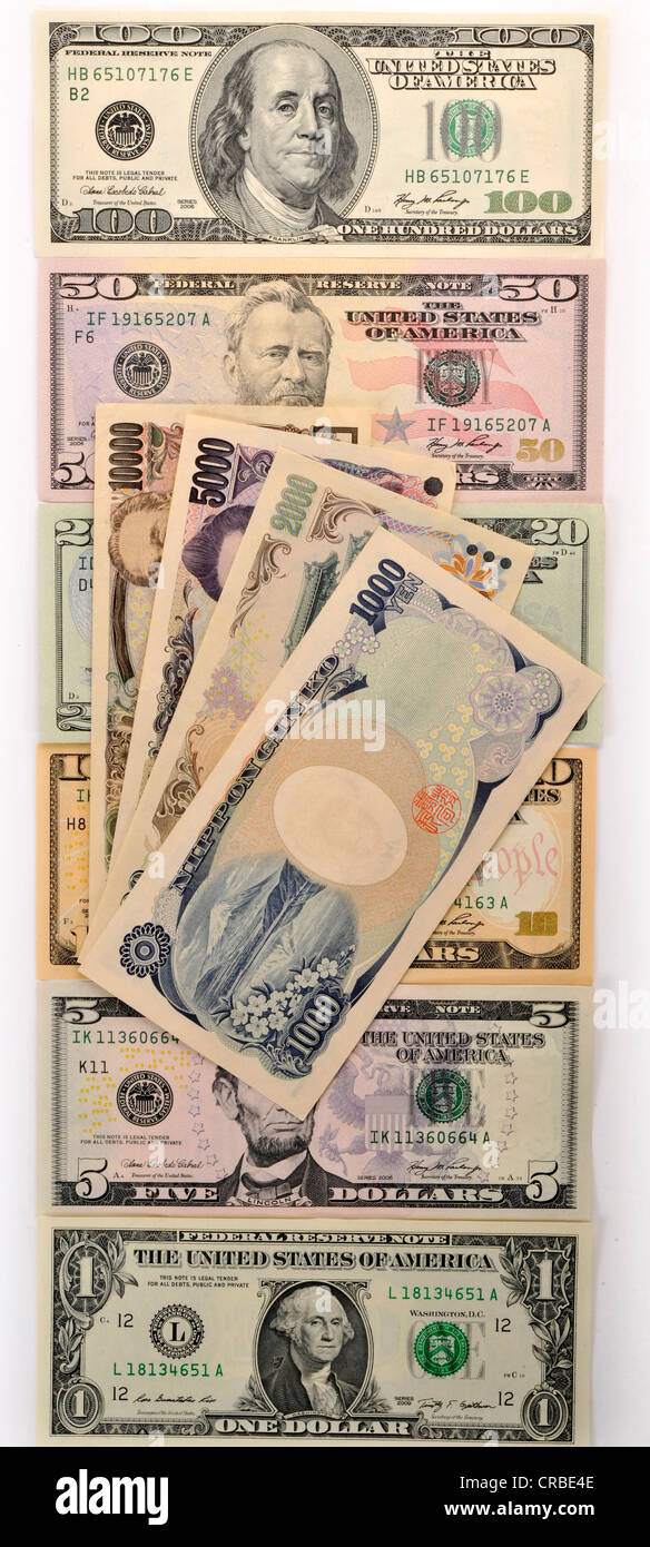 Symbolisches Bild für Wechselkurse, US-Dollar-Banknoten und ein Fan der japanischen Yen-Banknoten Stockfoto