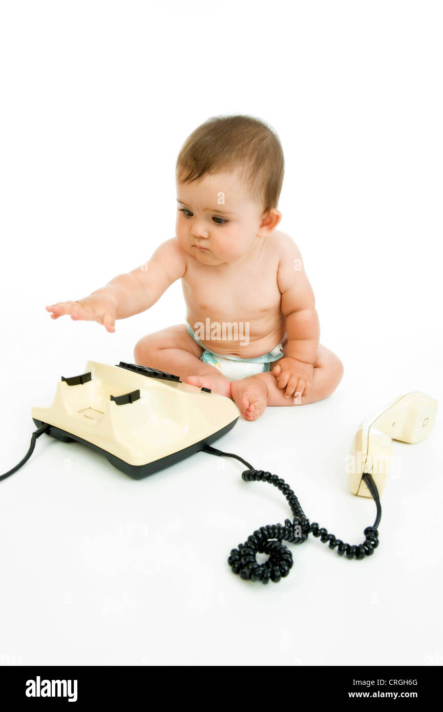 kleines Kind mit Telefon-apparat Stockfoto