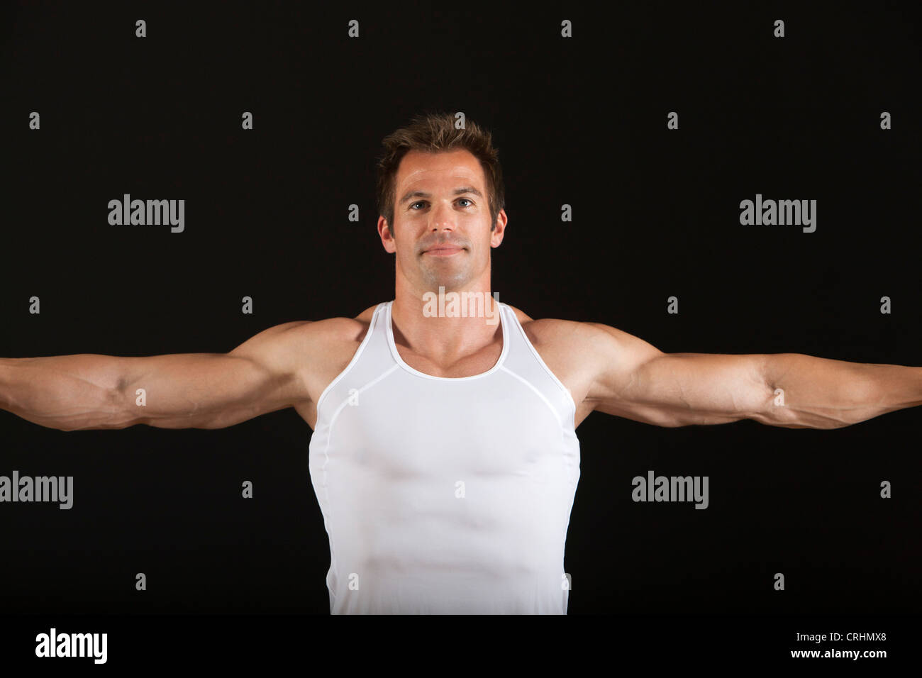 Muskulöser Mann in Tank-top Stockfoto