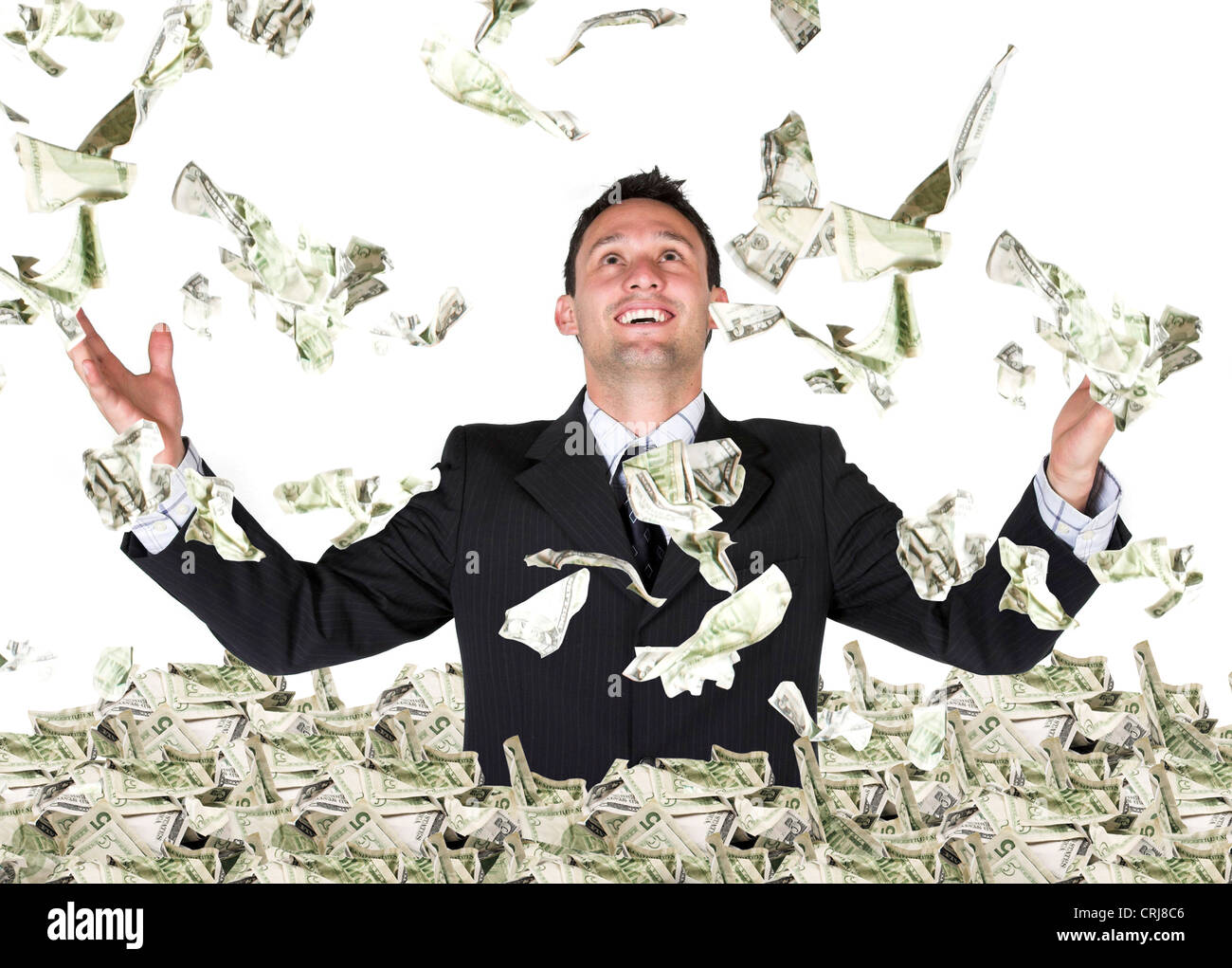 Business Millionär in Dollar Regen Stockfoto