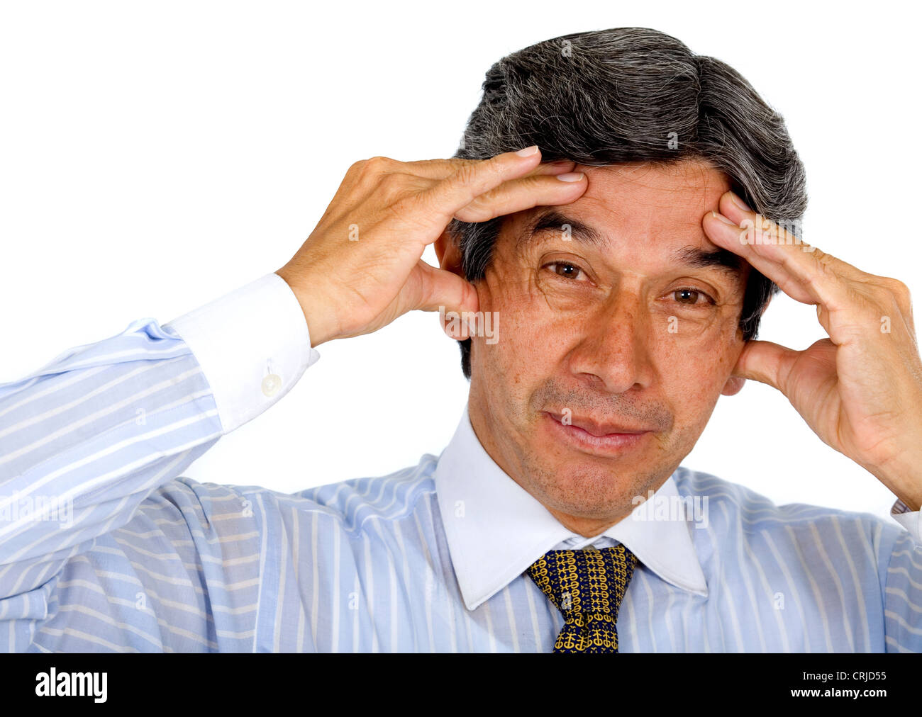 Business-Mann mit seinen Händen auf dem Kopf betont, als hätte er Kopfschmerzen Stockfoto