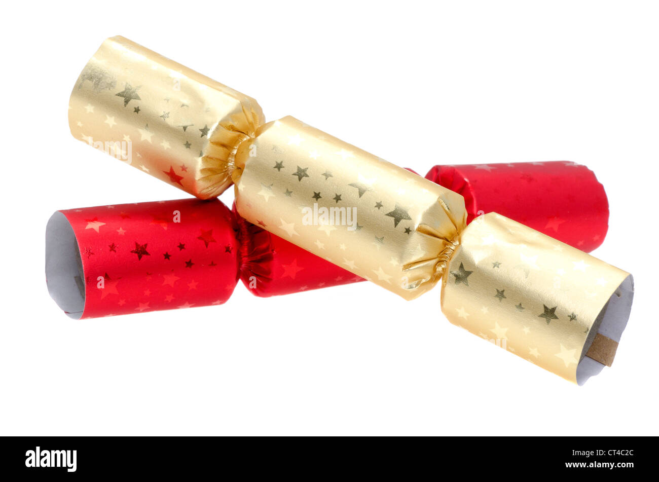 Rot und gold Christmas Cracker - Studio gedreht mit weißem Hintergrund Stockfoto