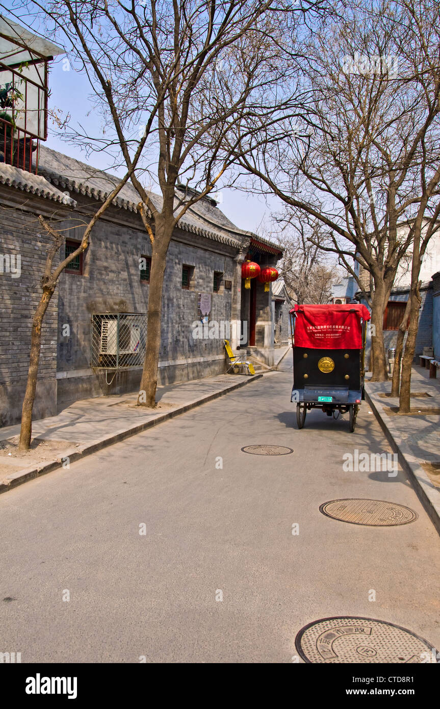 Rikscha in einer Straße von einem Hutong - Peking, China Stockfoto