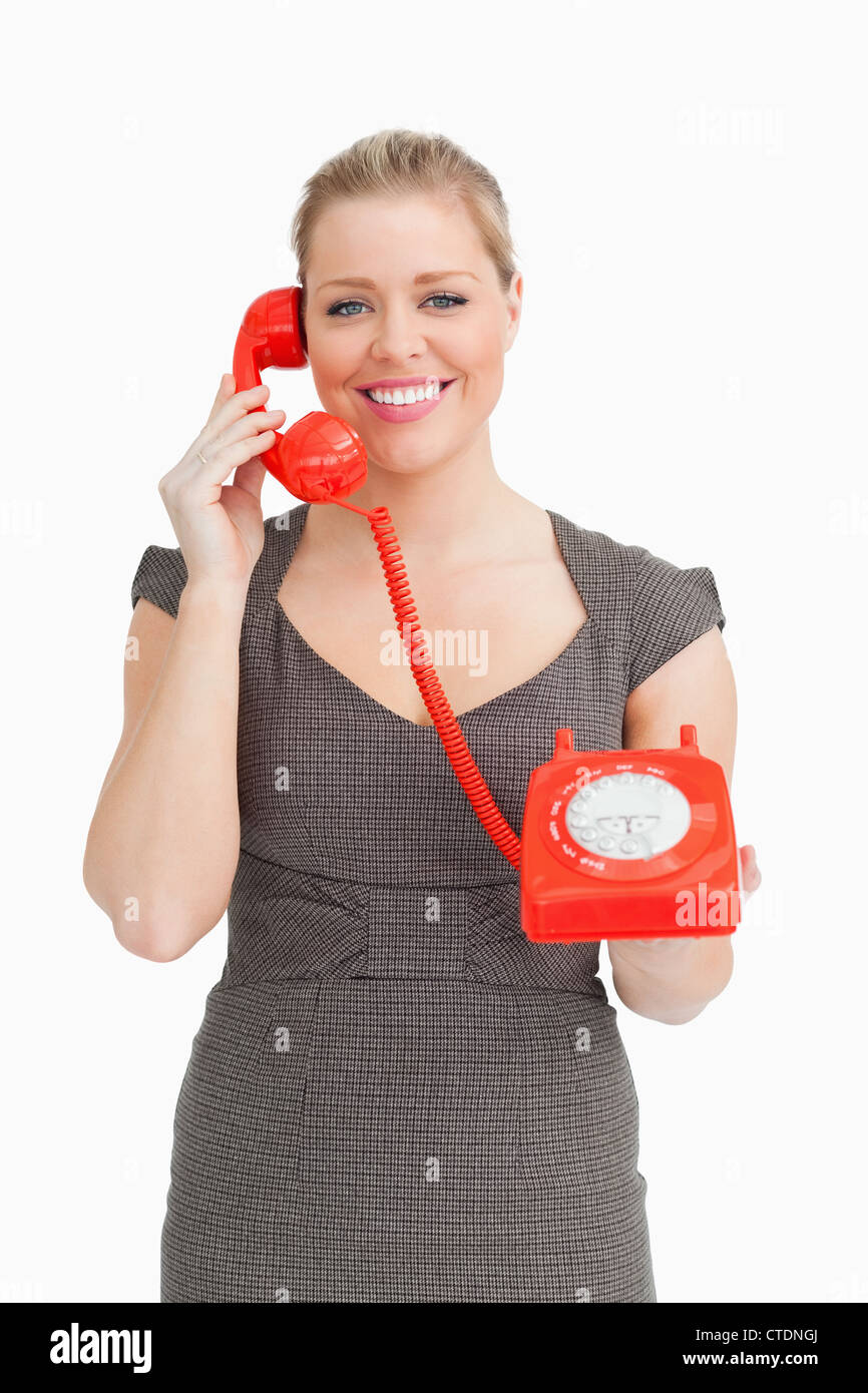 Frau mit einem Zifferblatt-Telefon anrufen Stockfoto