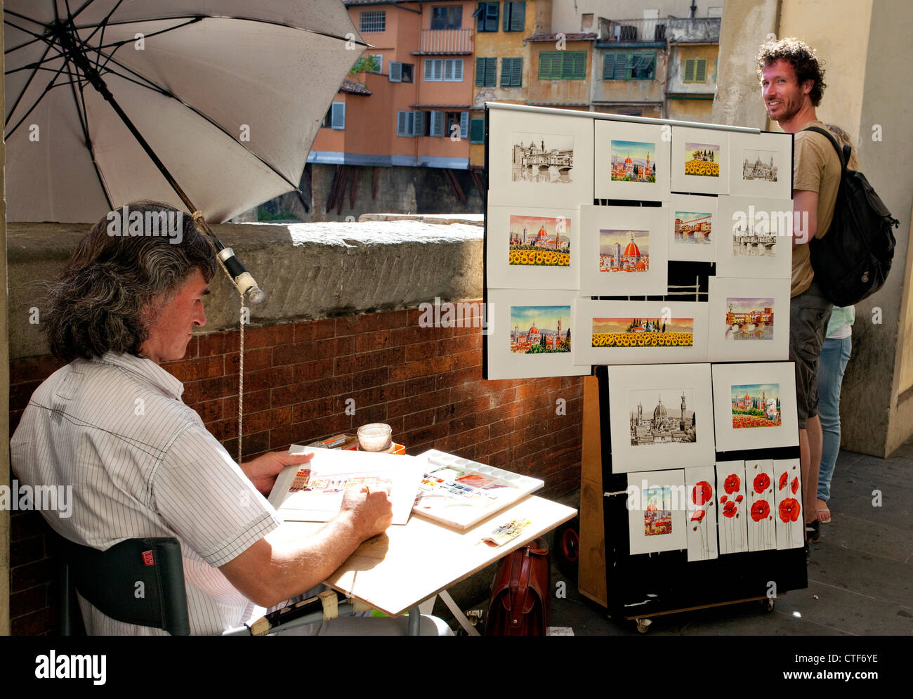 Streetart-Künstler bei der Arbeit in der Nähe von Ponte Vecchio, Florenz, Italien Stockfoto