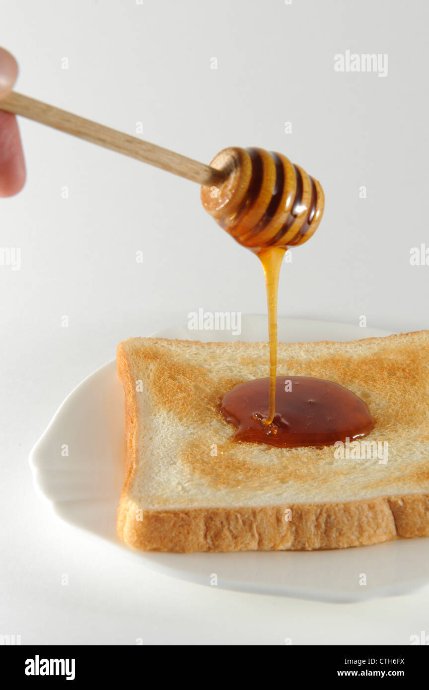 Honig Pendelarm tropfende takano Herzen wamitsu Honig auf Toast, Tokio, Japan Stockfoto Honig Pendelarm tropfende takano Herzen wamitsu Honig auf Toast, Tokio, Japan Stockfoto