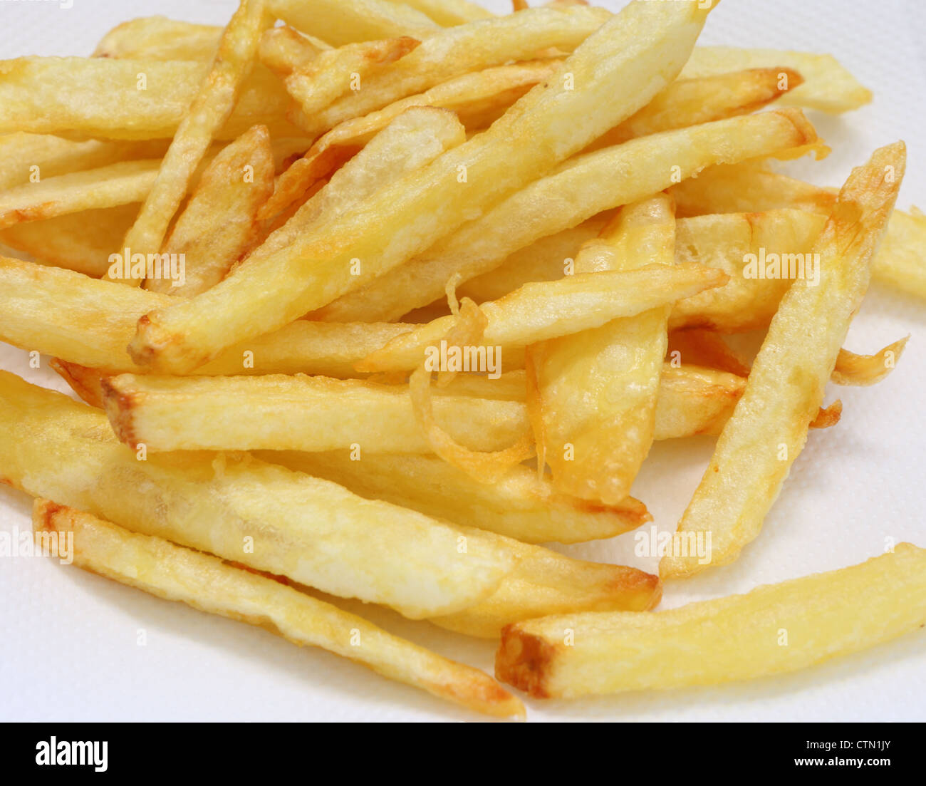 Ein Haufen von Golden, hausgemachte Pommes frites oder gebratene Kartoffelchips, Nahaufnahme Stockfoto