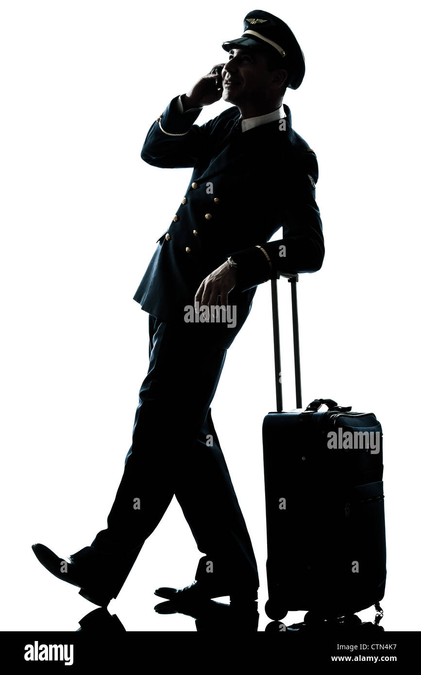 ein kaukasischer Mann in Airline-Piloten uniform im Studio isoliert auf weißem Hintergrund Stockfoto