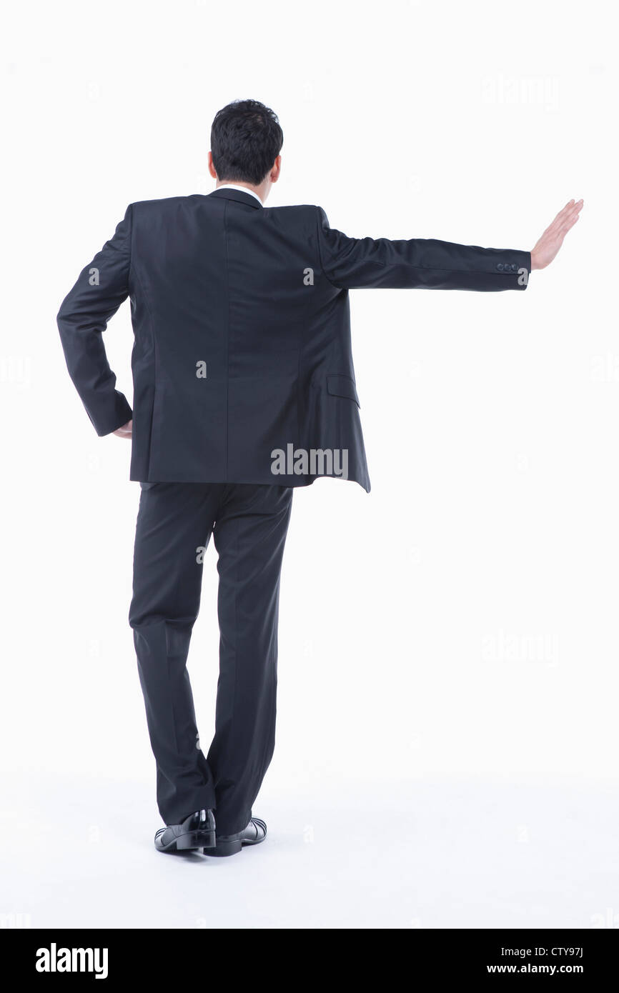 Ein Mann mit seiner Hand an die Wand gelehnt Stockfoto