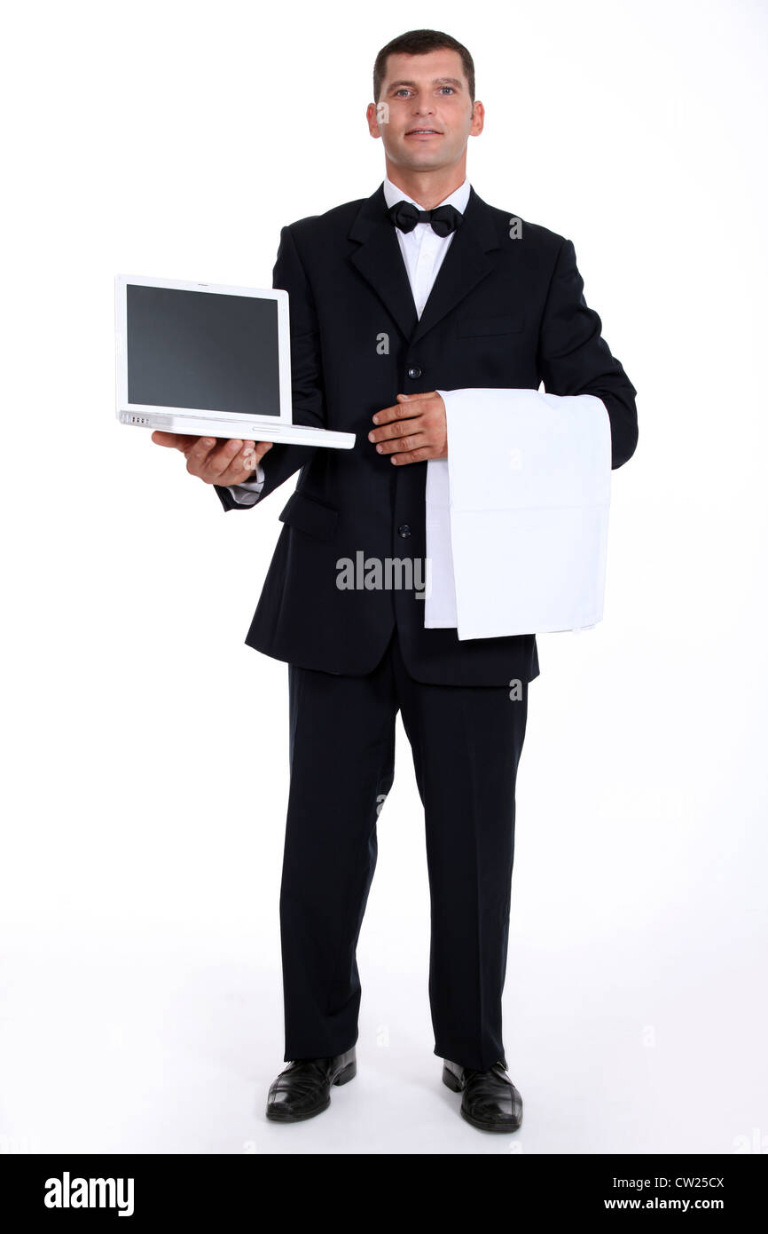 Kellner mit einem laptop Stockfoto