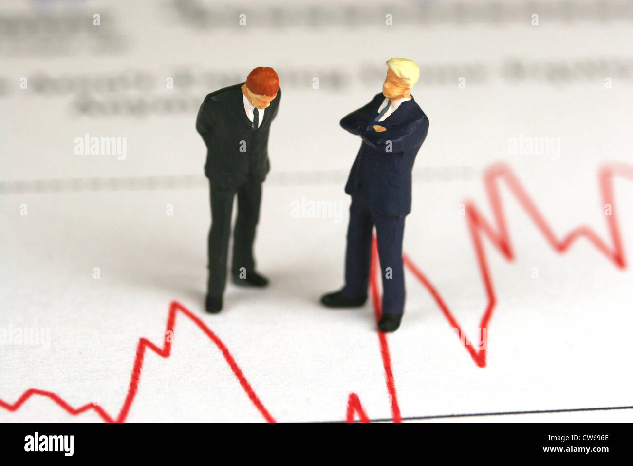 symbolisches Bild Finanz Krisen, Aktienkurs mit Manager Zahlen Stockfoto