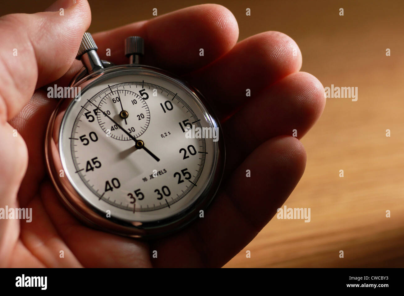 Mann-Betrieb-Stoppuhr Stockfoto
