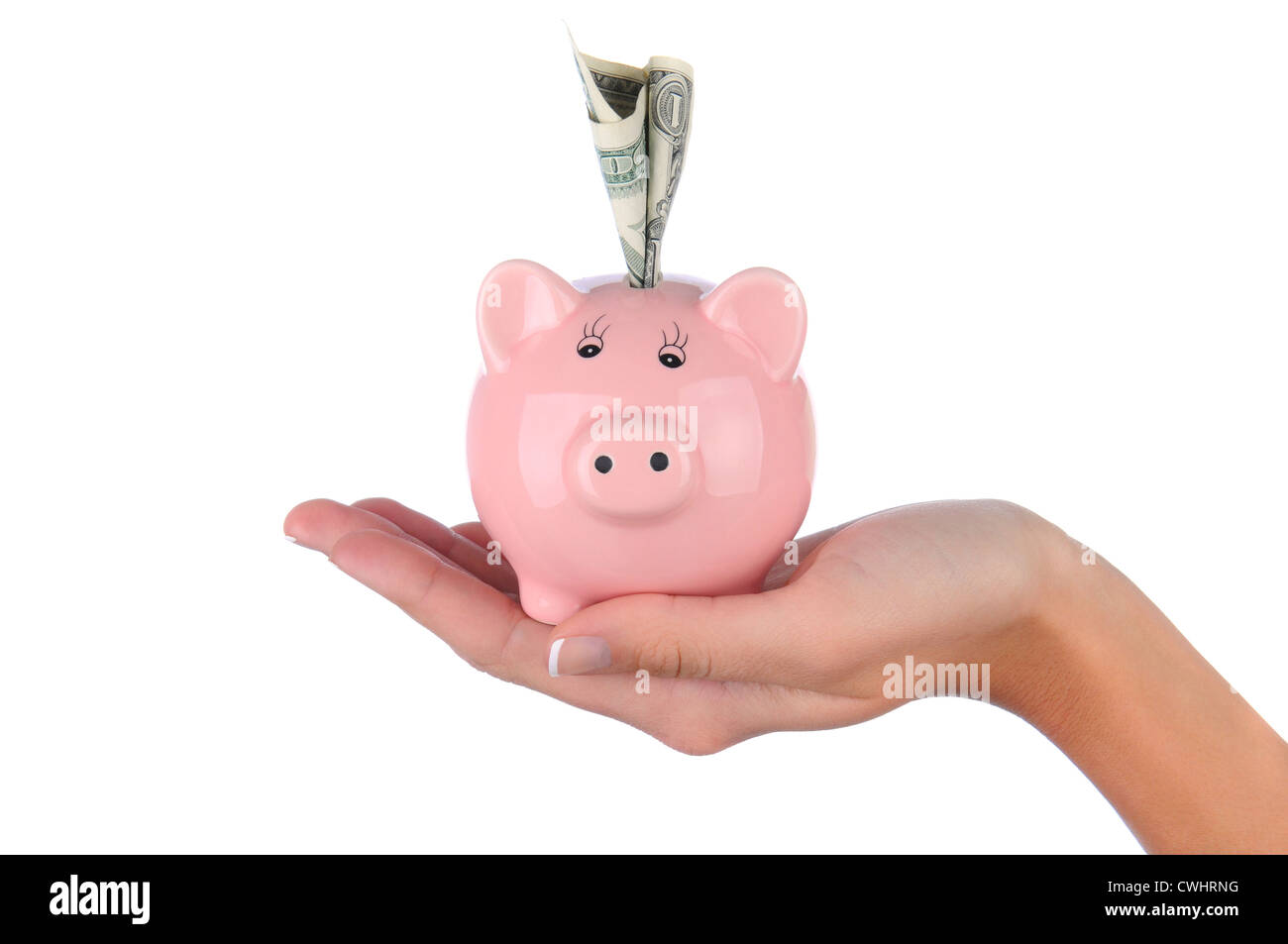 Nahaufnahme von einer Frau Hand hält ein rosa Sparschwein mit einer Dollarnote in den oberen Steckplatz stecken. Stockfoto