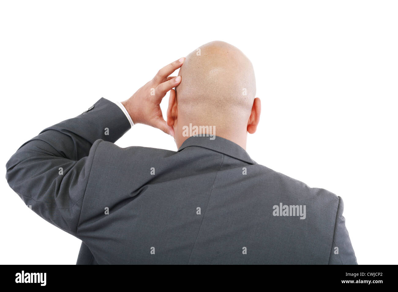Hübscher Junge Geschäftsmann in modernen eleganten Anzug Stand zurück, isoliert auf weißem Hintergrund. Konzept, Idee, Frage, Stockfoto