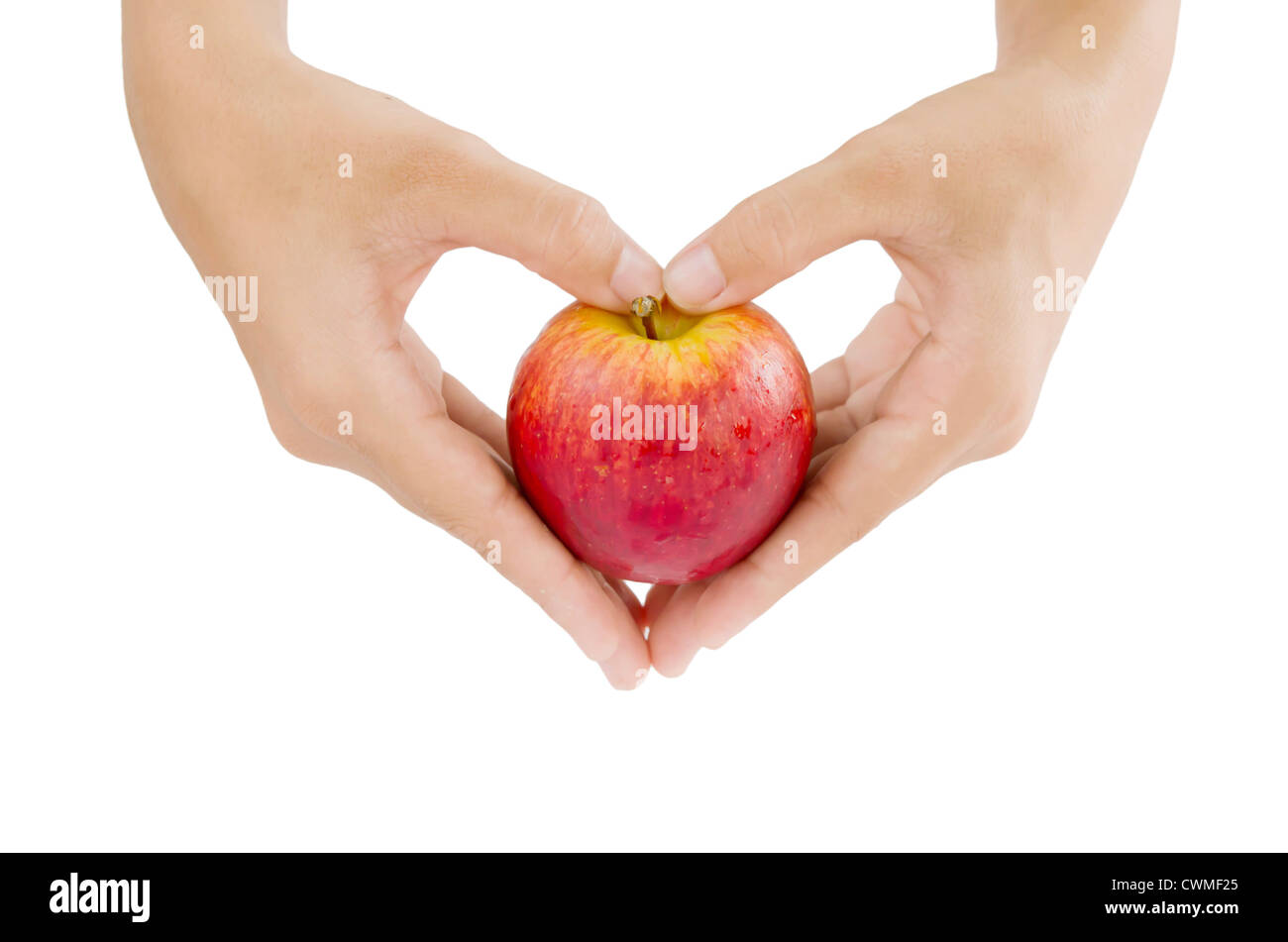 weibliche Hand und Apfel auf weißem Hintergrund Stockfoto