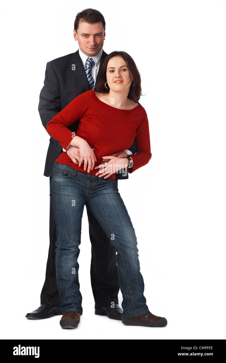 Porträt von ein attraktives junges Paar umarmt vor weißem Hintergrund Stockfoto