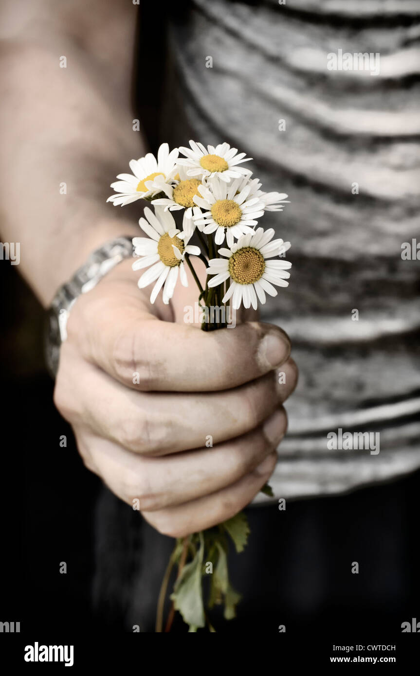 Halten Blumen Stockfoto