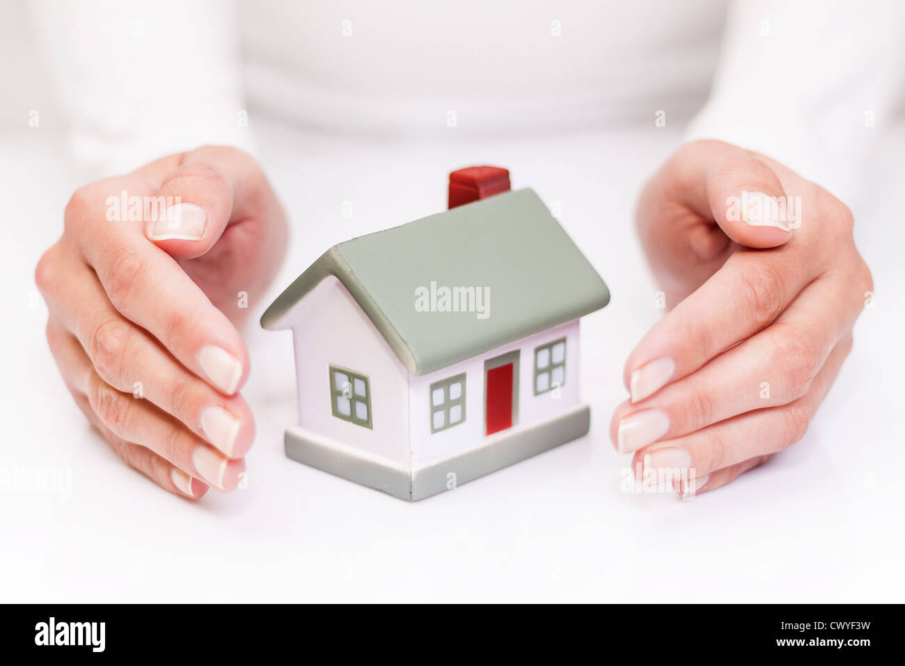 Schützen Sie Ihr Haus. Isoliert auf weiss. Stockfoto