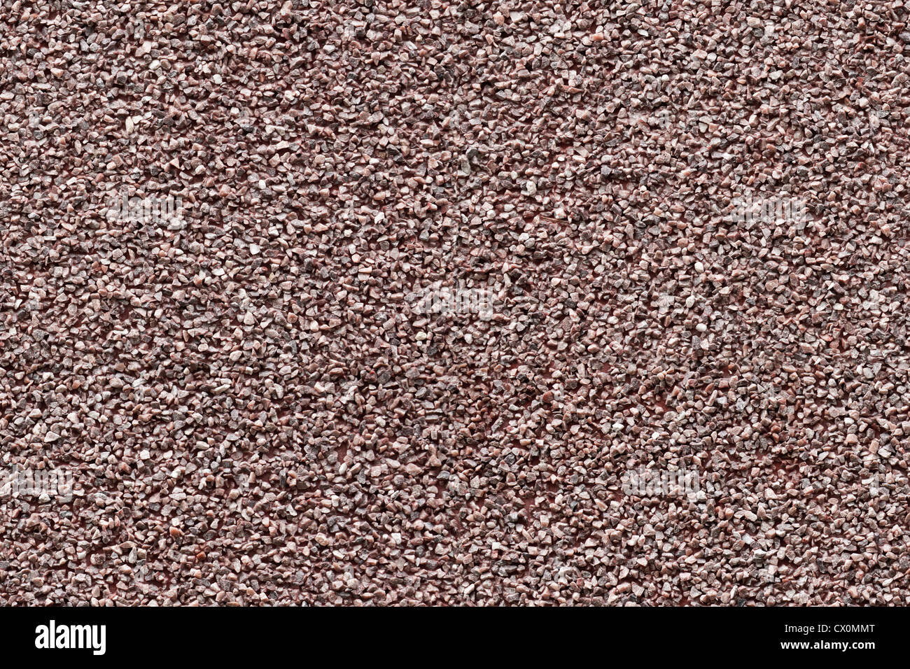 Nahtlose Hintergrundtextur aus rotem Granit chips panel Stockfoto