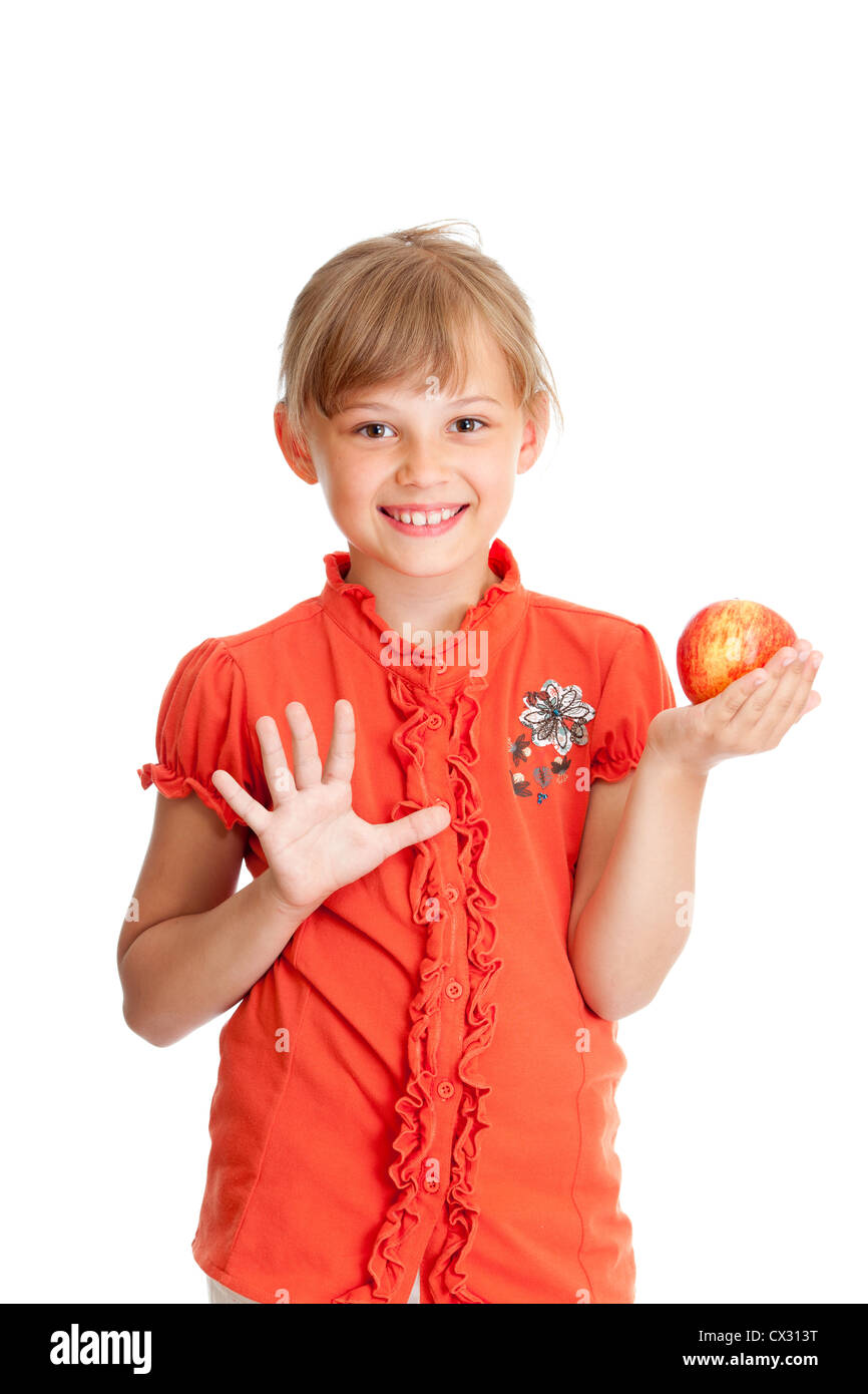 Schulportrait Mädchen essen roten Apfel, isoliert Stockfoto