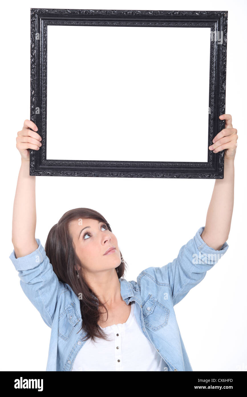 Frau mit einem Spiegel Stockfoto