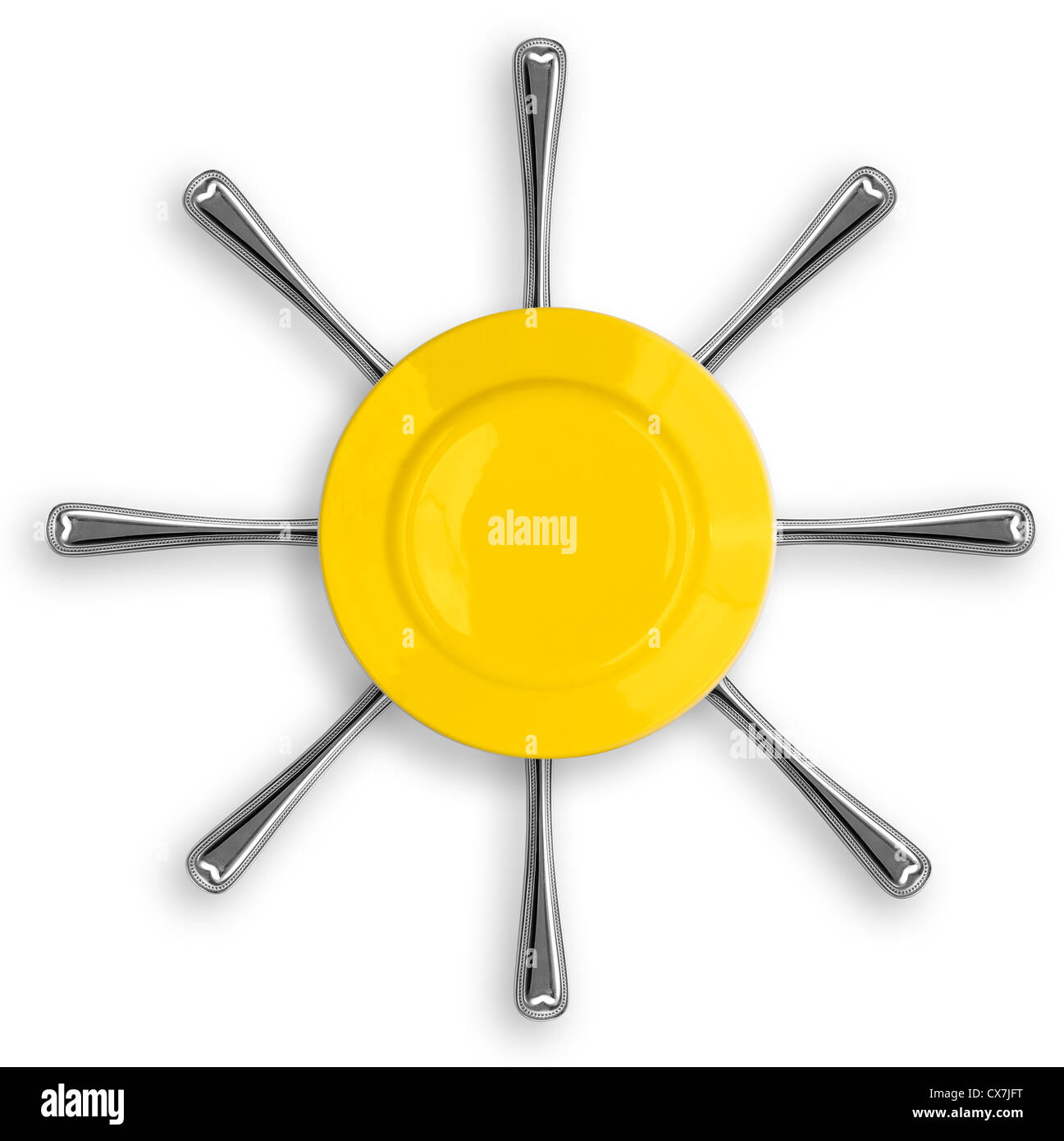 Gelbe runde Platte mit acht Gabeln in Form einer Sonne Stockfoto