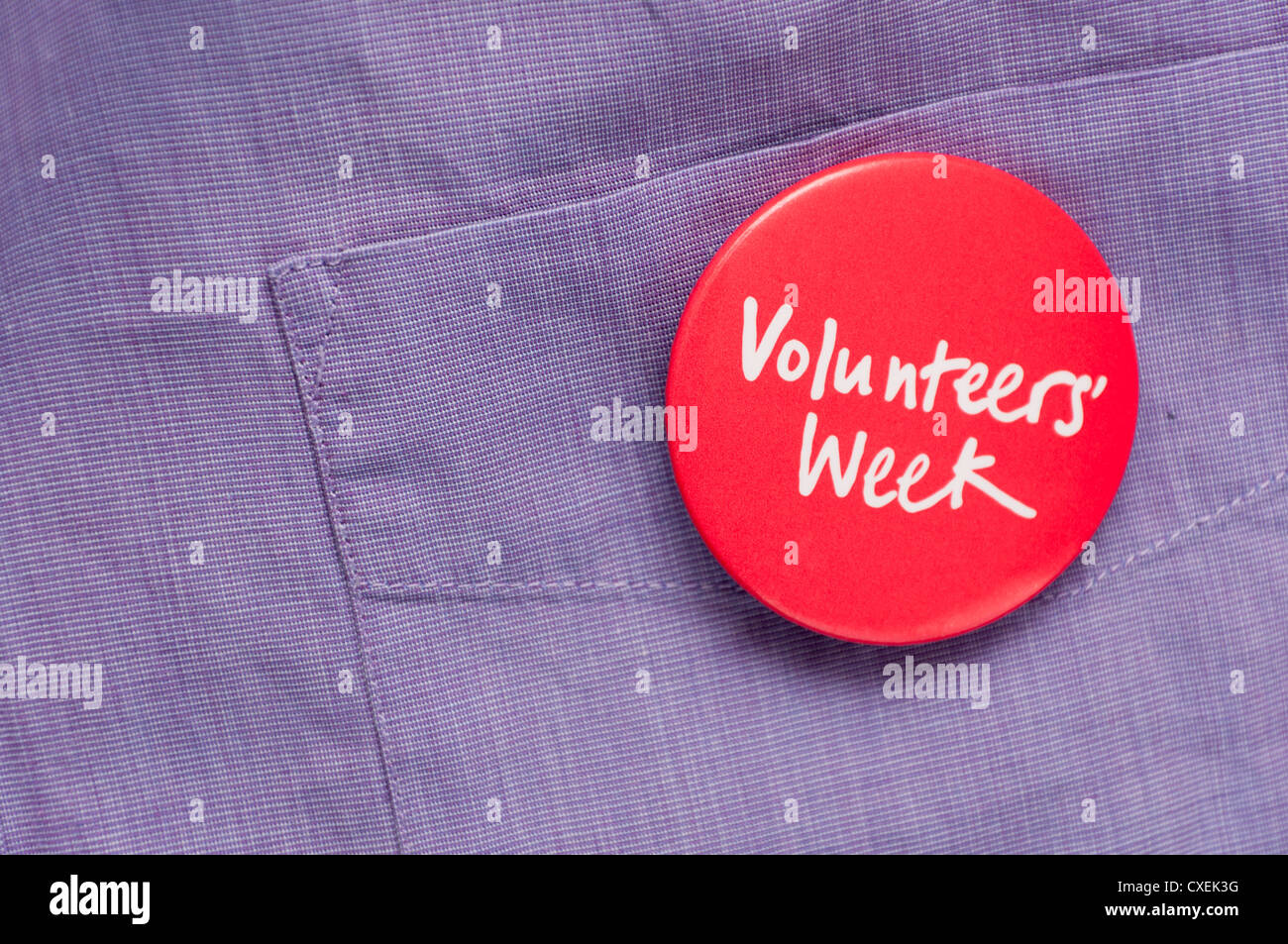 Freiwillige Förderung freiwilliger freiwilliges Engagement tragen Woche Abzeichen Stockfoto