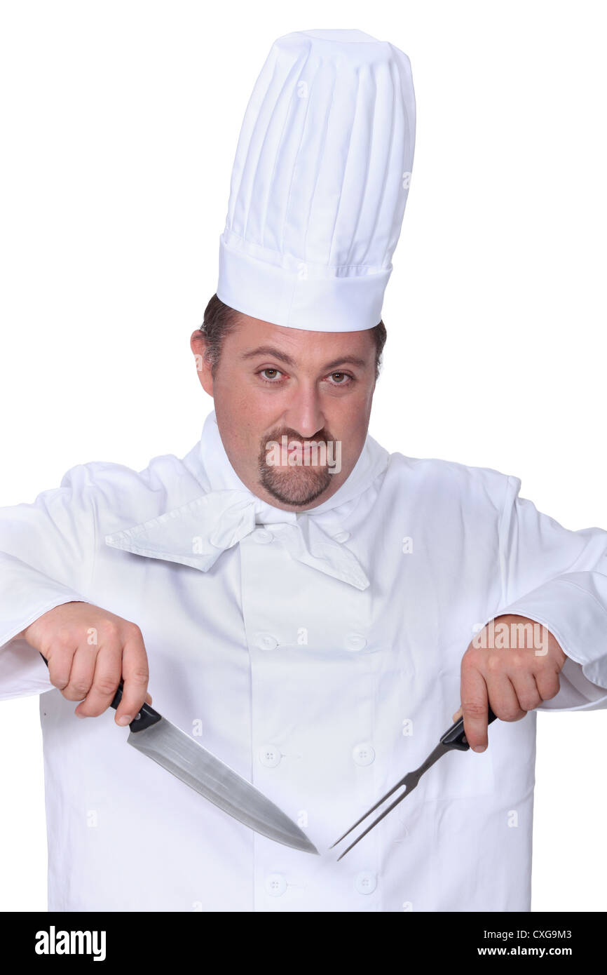 Koch mit Messer und Gabel Stockfoto