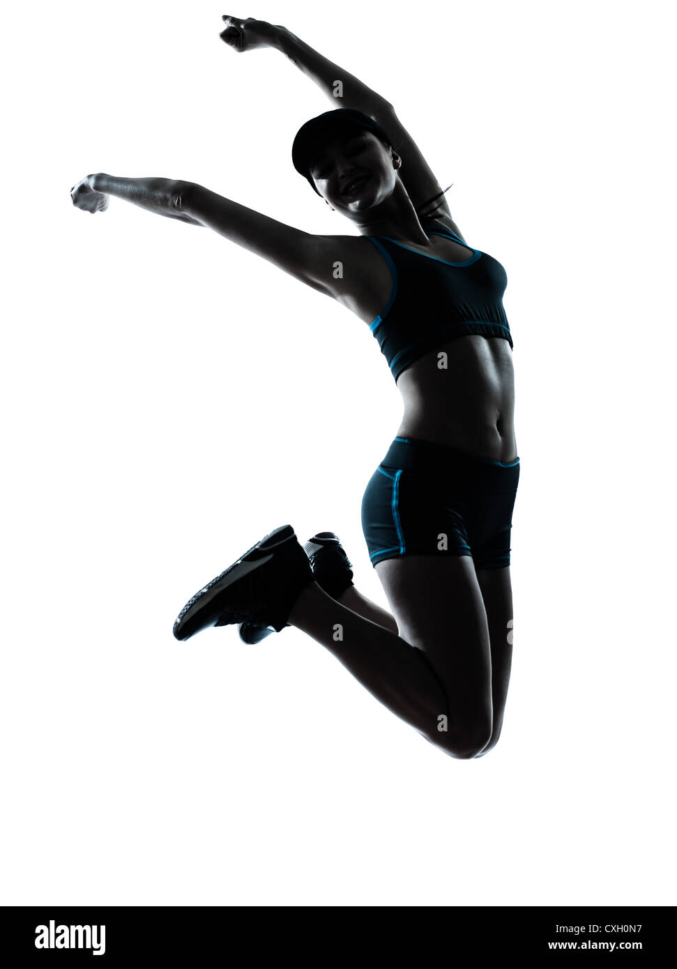 eine Kaukasische Frau Läufer Jogger springen glücklich springen im Silhouette Studio isoliert auf weißem Hintergrund Stockfoto