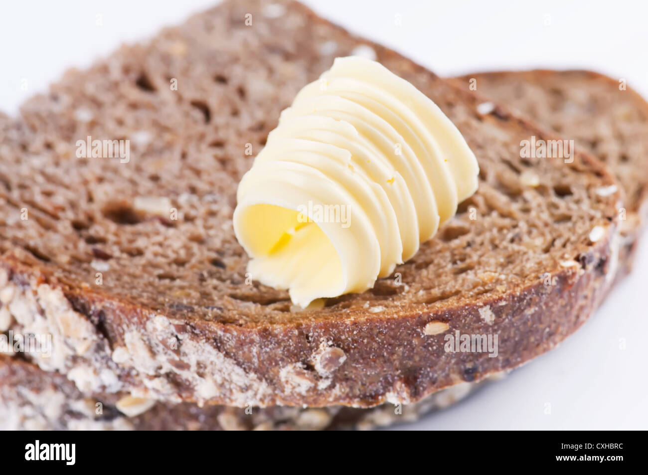 Stück Brot mit butter Stockfoto